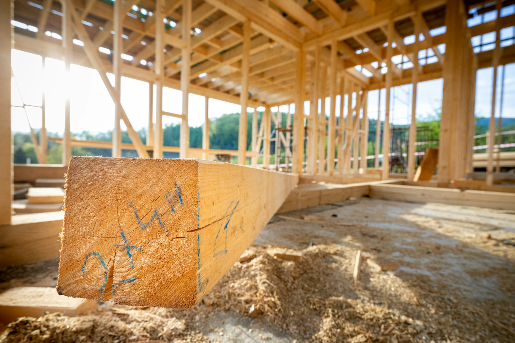 Wooden beam at the construction of a frame house